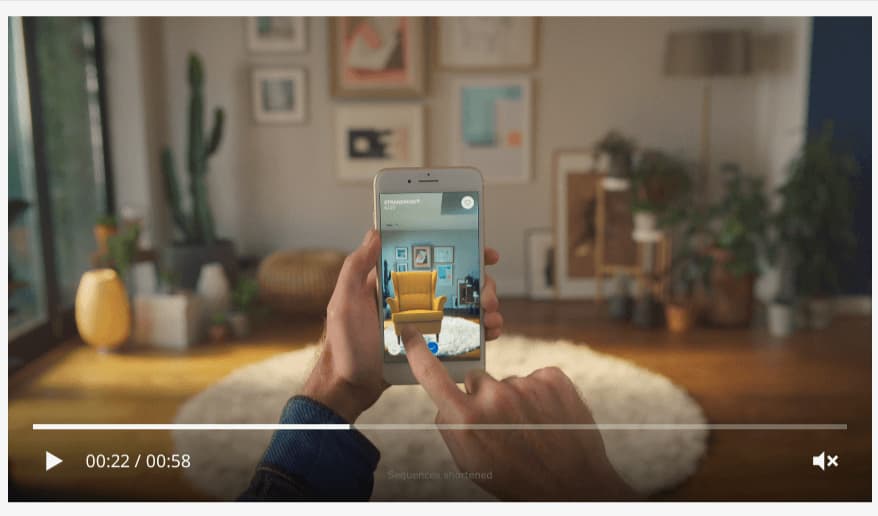 A person uses the IKEA Place AR app to visualize furniture in their room, showcasing the e-commerce trend of augmented reality